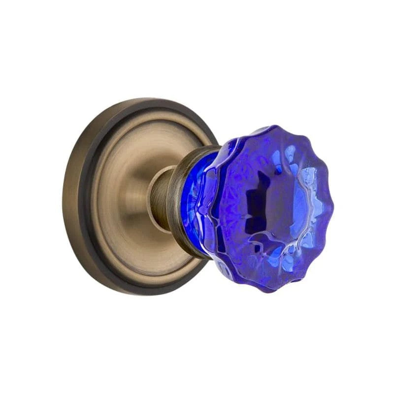 Nostalgic Warehouse Classic Rosette Privacy Crystal Cobalt Glass Door Knob in Antique Brass